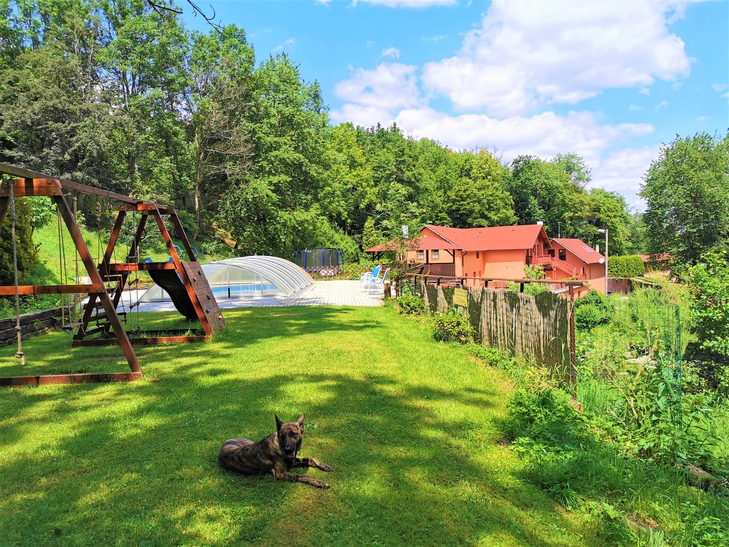 Pool and playground area at Penzion Liškův Mlýn